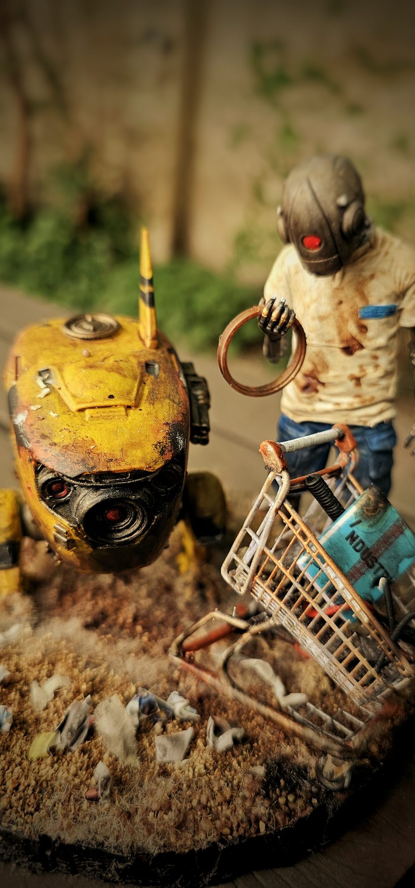 Vertical close view of RoboChick and the salvage robot searching through debris