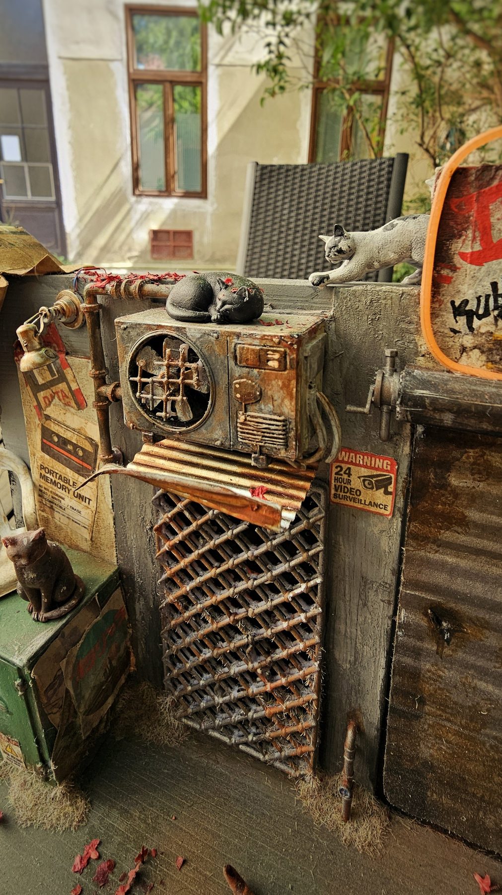 Weathered machinery and rooftop cats in the Lunch Time diorama