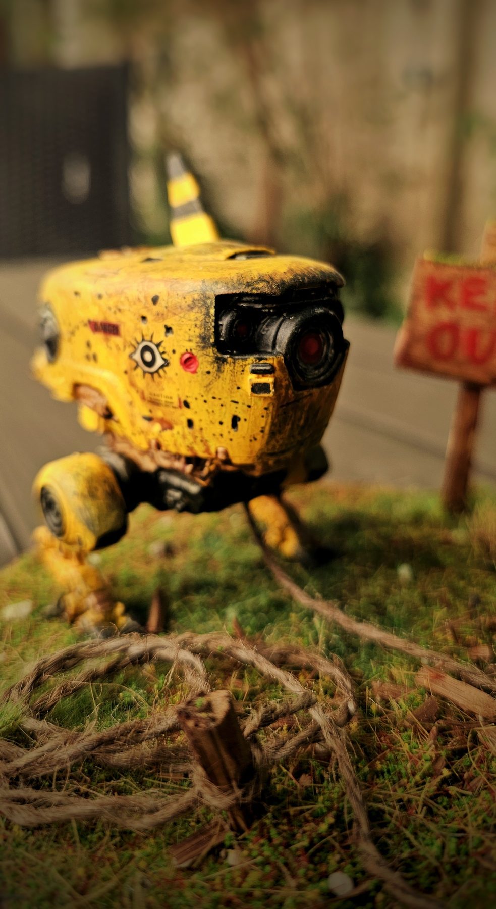 Close view of RoboChick's weathered yellow robotic body