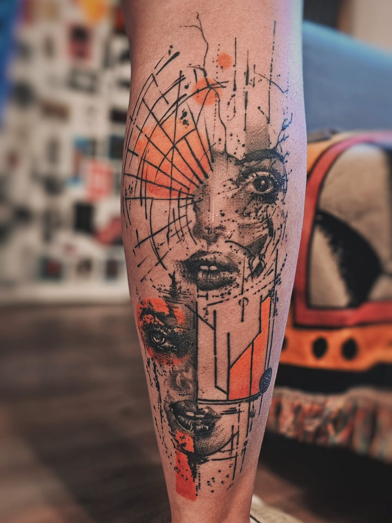 Humanism tattoo with abstract face and orange graphic marks