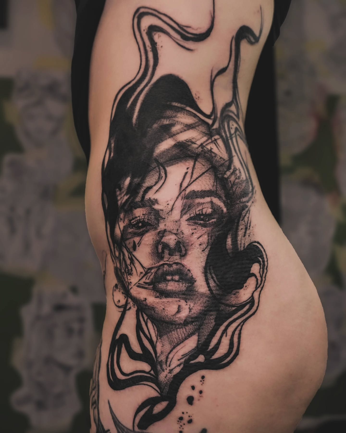 Humanism blackwork portrait tattoo on torso