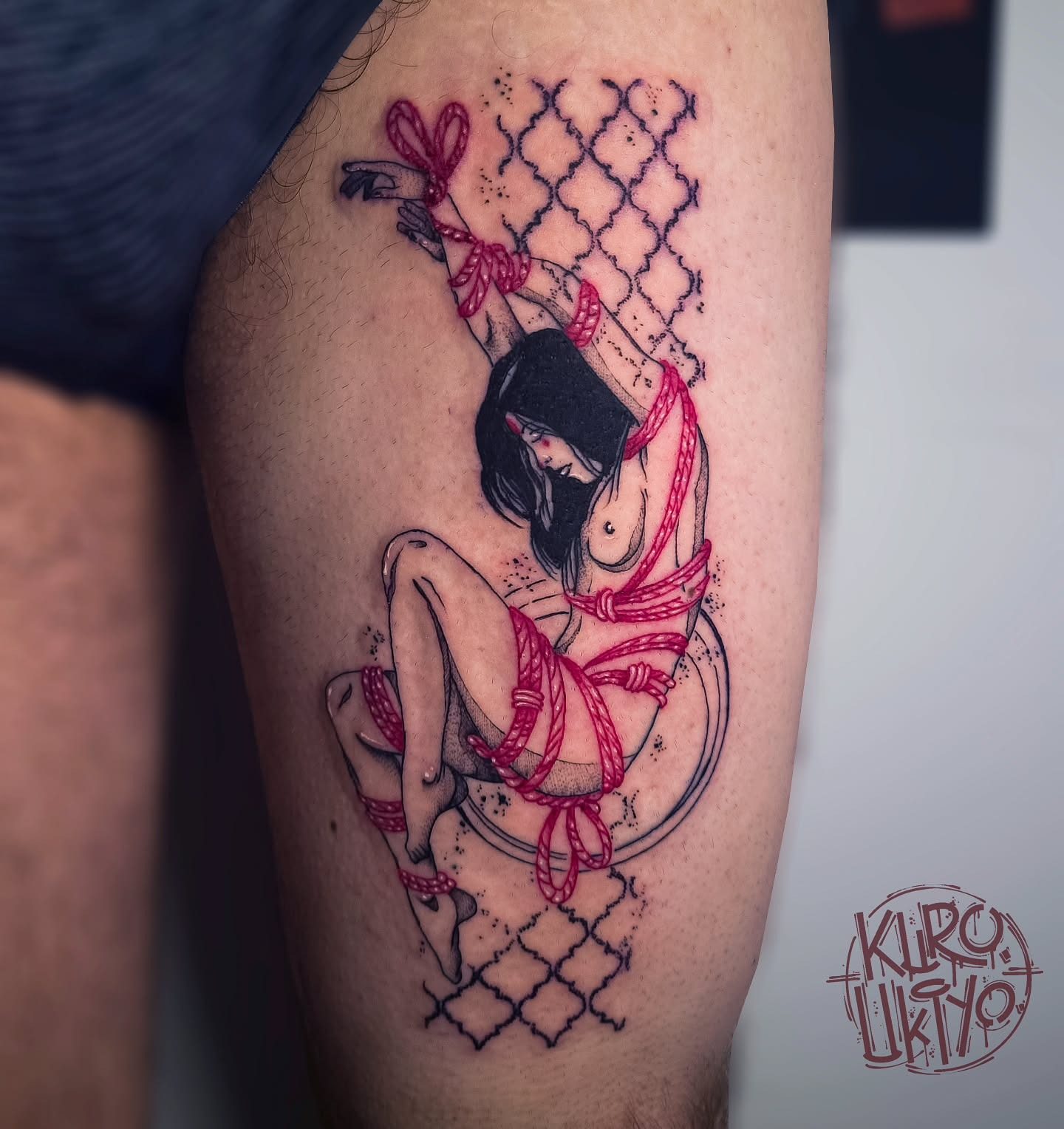 Humanism tattoo with bound figure and red rope